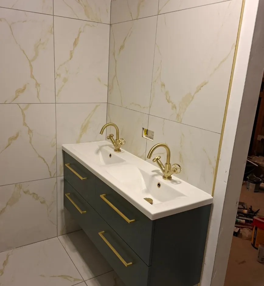 Double bathroom vanity with twin basins and warm oak cabinetry